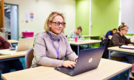 Adult Boston College Learner using Laptop
