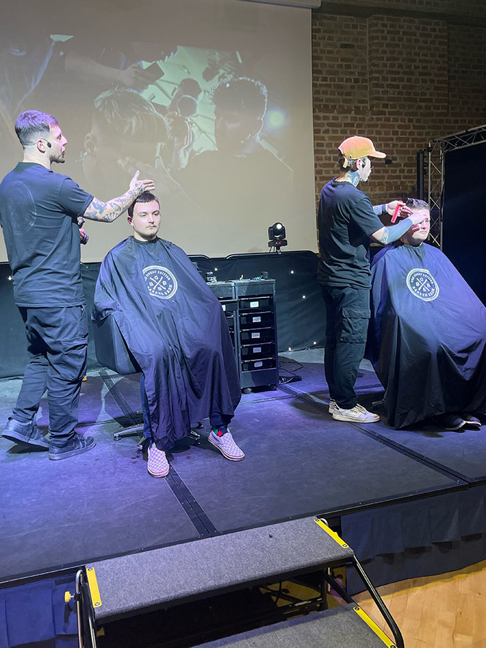 Two Barbers from The Great British Barber Bash working on their models.