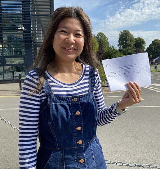 Boston College Learner posing with GCSE Results looking into camera