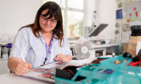 Boston College Adult Art and Design Learning working on her sketch book