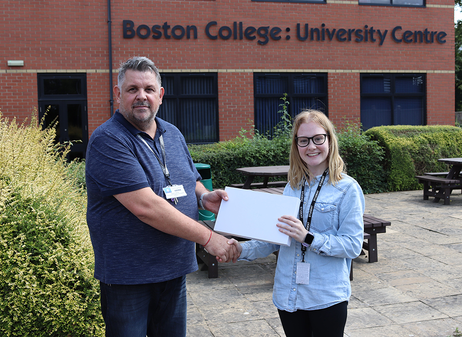 Annie receiving her free tablet for completing the course from Employability Tutor Steve Cottrell