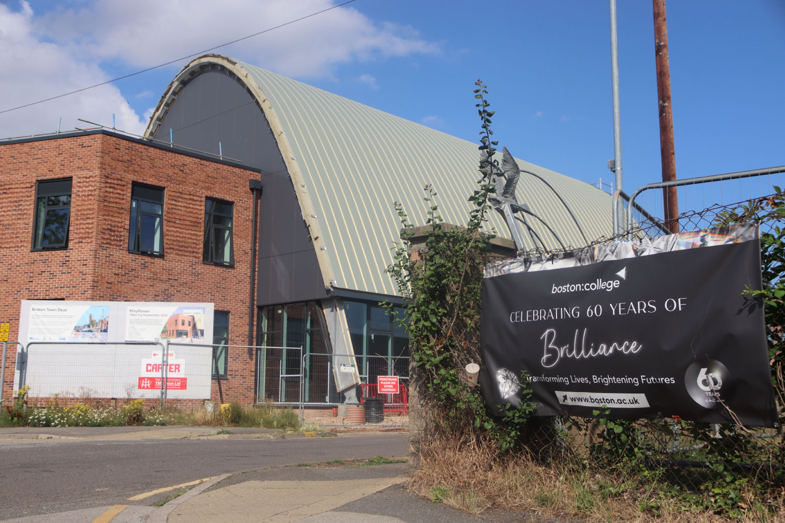 Boston College Mayflower Building Development and Boston College Celebrating 60 Years of Brilliance Banner
